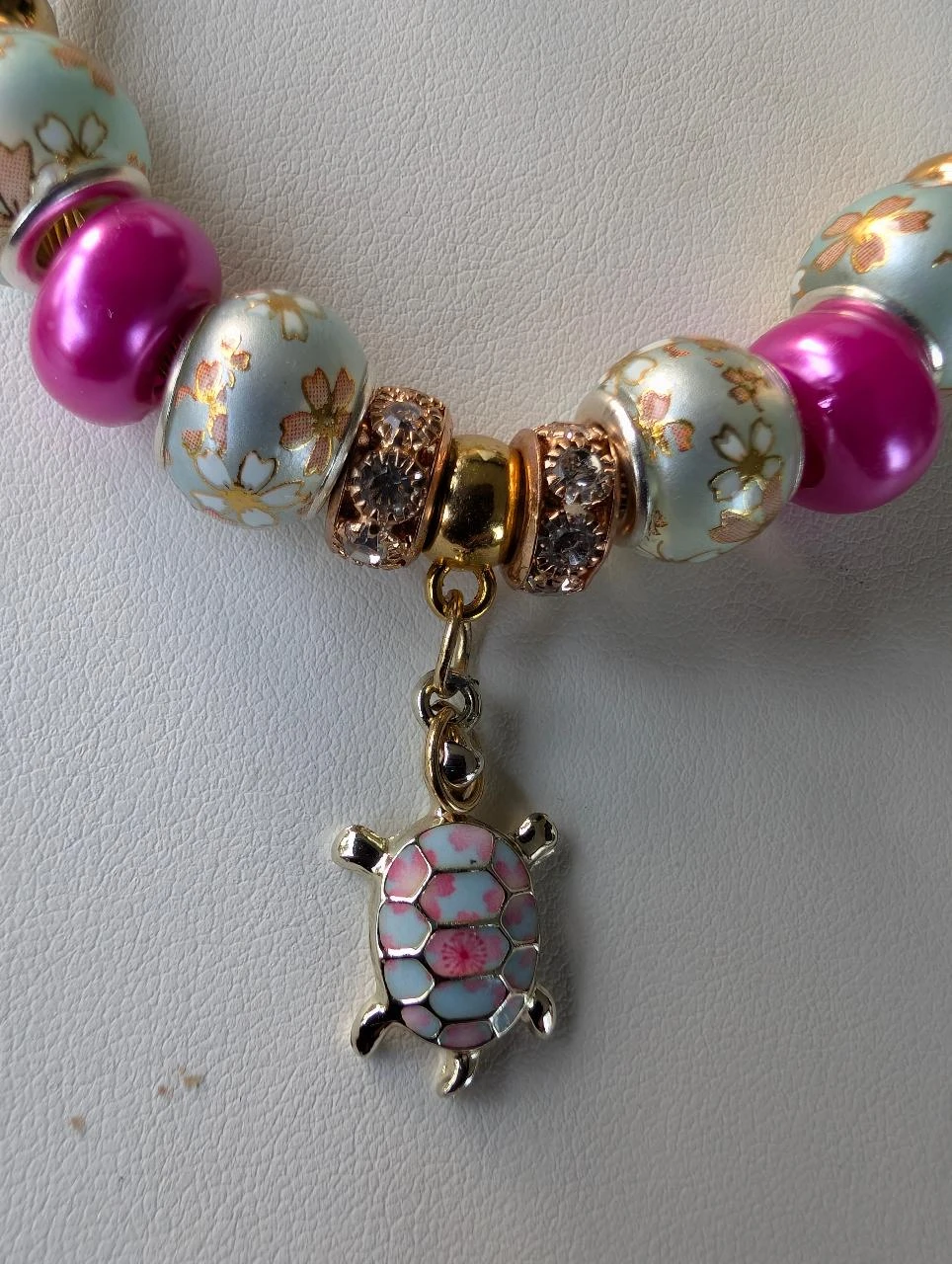 European bracelet with Japanese sakura charms and turtle charm – photo 2